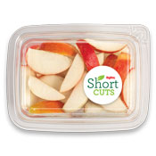 top view of a plastic container with apples slices in it