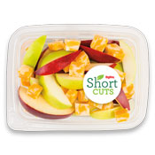 Red and green apple slices in a container with chunks of colby jack cheese