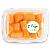 top view of a plastic container with cut up cantaloupe