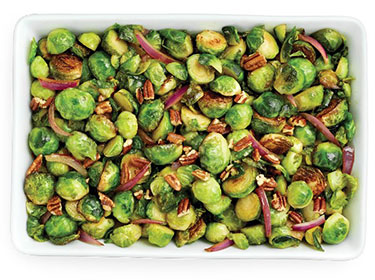 a large platter full of caramelized brussels sprouts