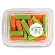 Top view of a container filled with carrots and celery slices