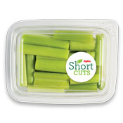 Sticks of celery that have been cut and placed in a plastic container