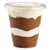 A cup of chocolate pudding with layers of whipped topping