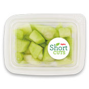 cut up honeydew melon in a plastic container
