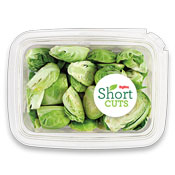 sliced up brussels sprouts in a plastic container