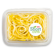 Yellow squash noodles piled up in a plastic container