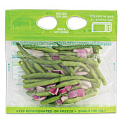 Green beans and sliced red onions in a clear plastic bag